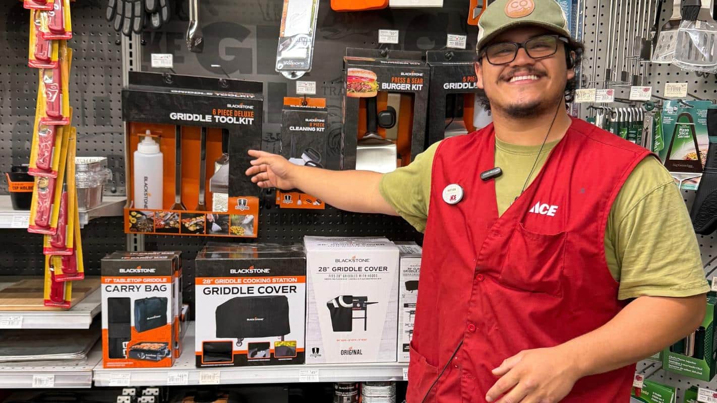 Colorado Ace Green Mountain team member showing a Blackstone griddle tool kit in the grilling department.