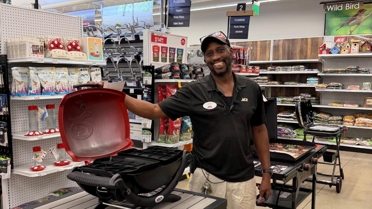 Golden – Doc: Doc from Colorado Ace Golden showing a portable propane grill in the store’s grilling department.