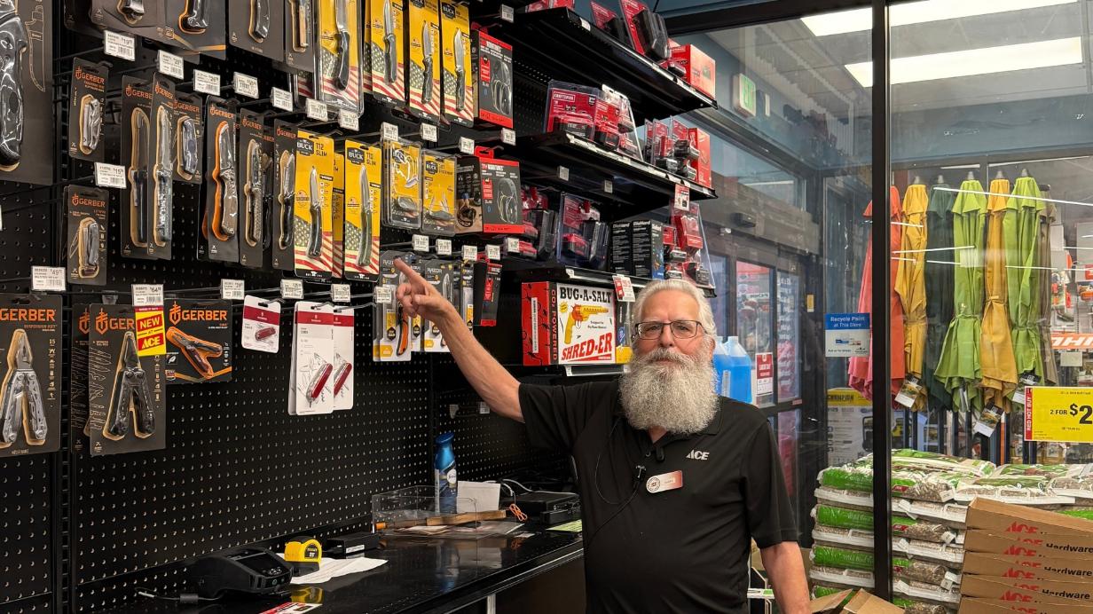 Golden – Gary: Gary from Colorado Ace Golden pointing to a selection of pocket knives and multi-tools.