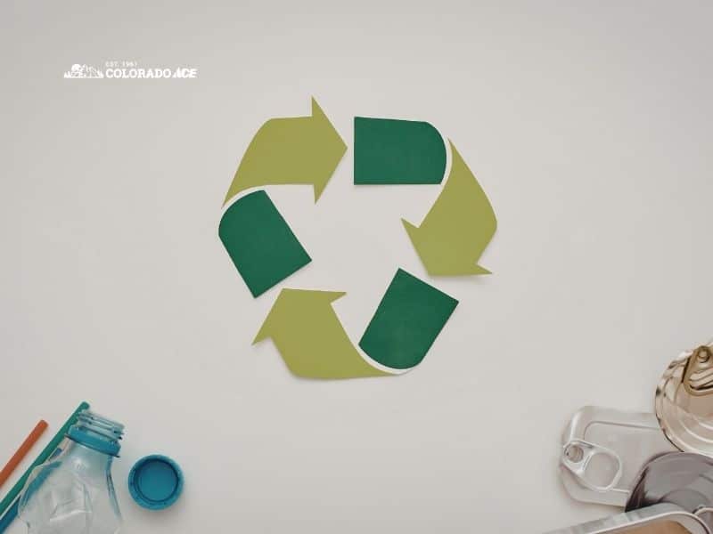 Recycling logo with plastic and tin cans