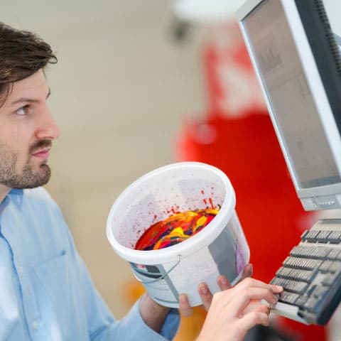 Paint matching pro working to make the perfect color for a customer