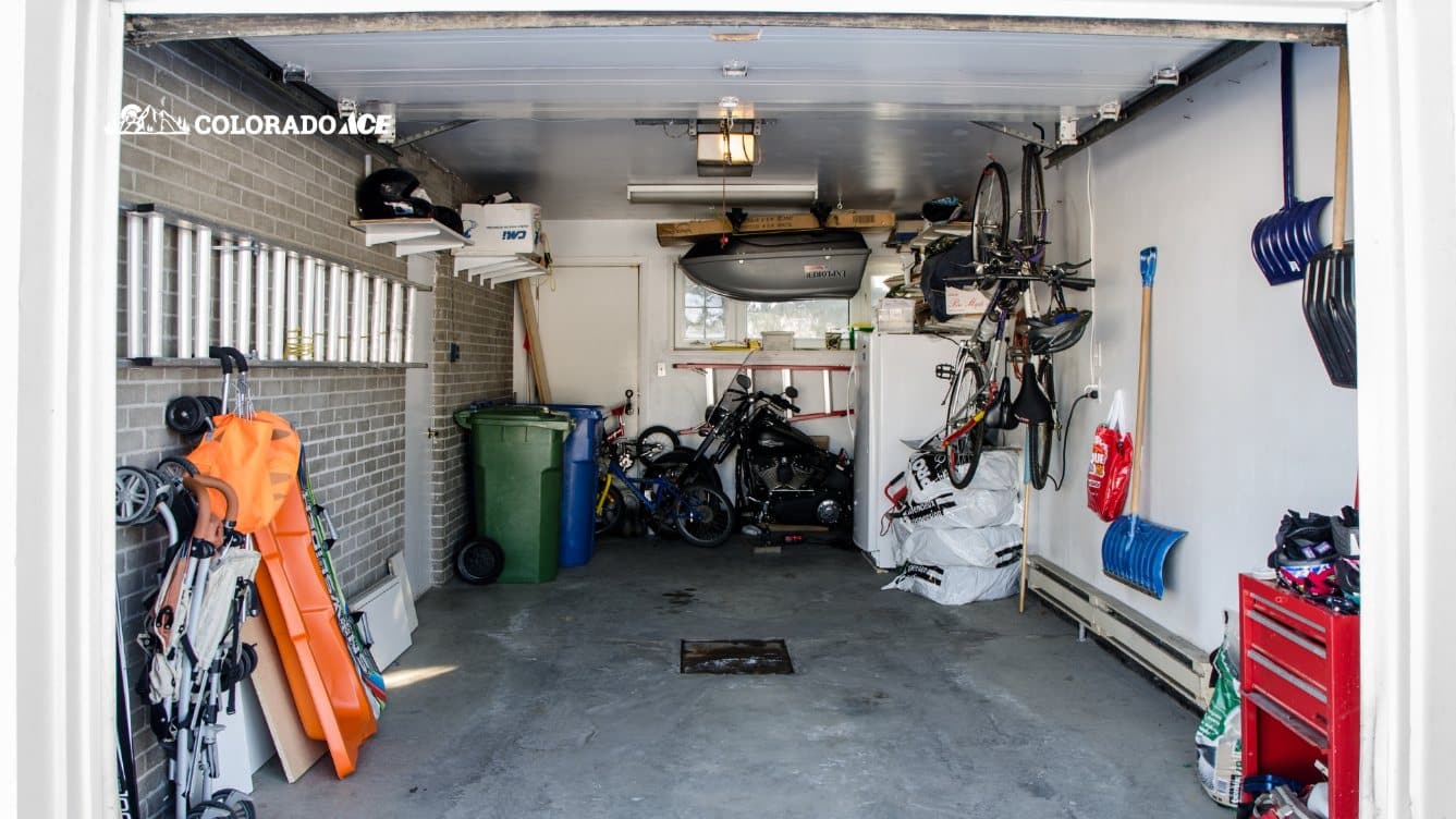 Organized garage with tools, storage bins, and bikes after spring cleaning