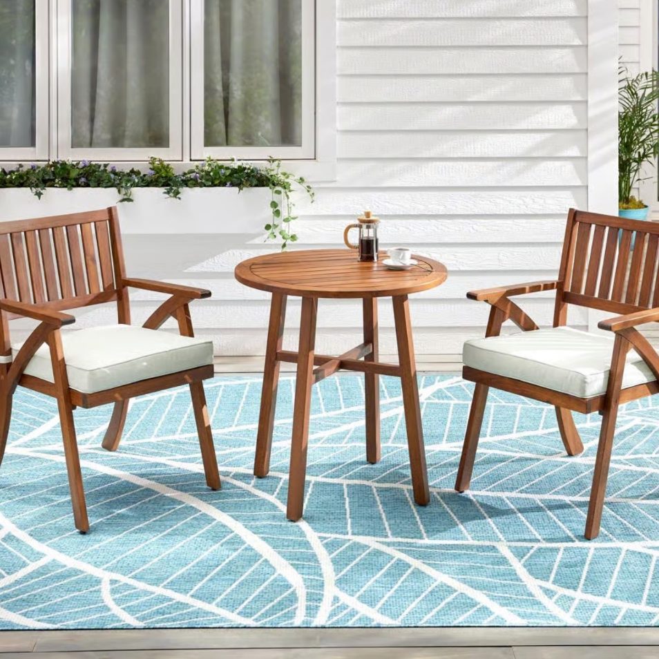 Outdoor wood bistro patio set with two chairs and table for backyard seating area