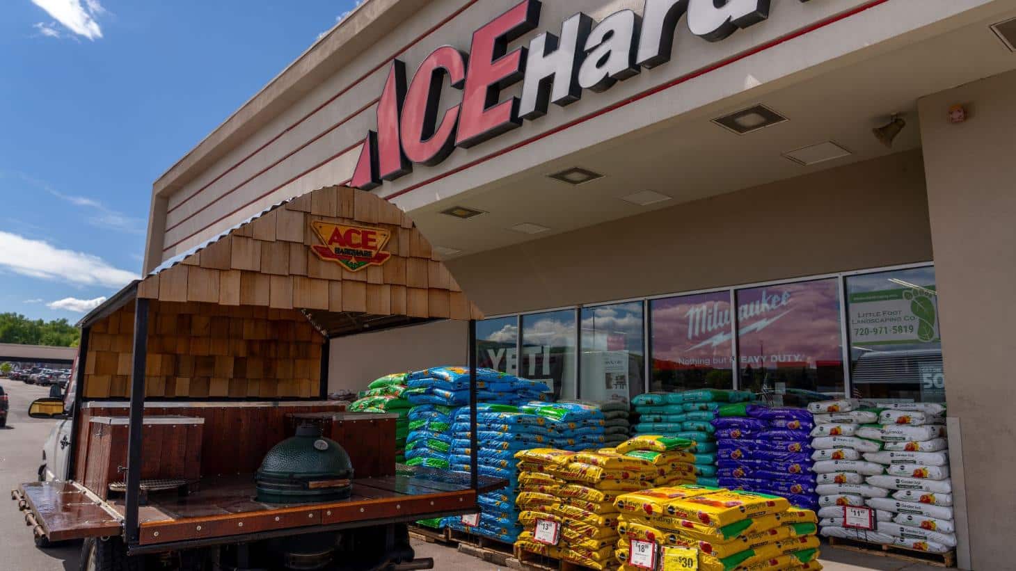 Exterior of Colorado Ace Green Mountain featuring outdoor grilling displays and landscaping supplies.